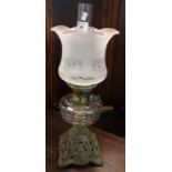 Early 20th Century double burner oil lamp having frosted glass shade, clear glass reservoir and