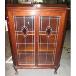 Early 20th Century astragal glazed two door display cabinet on cabriole legs and pad feet. (B.P. 21%