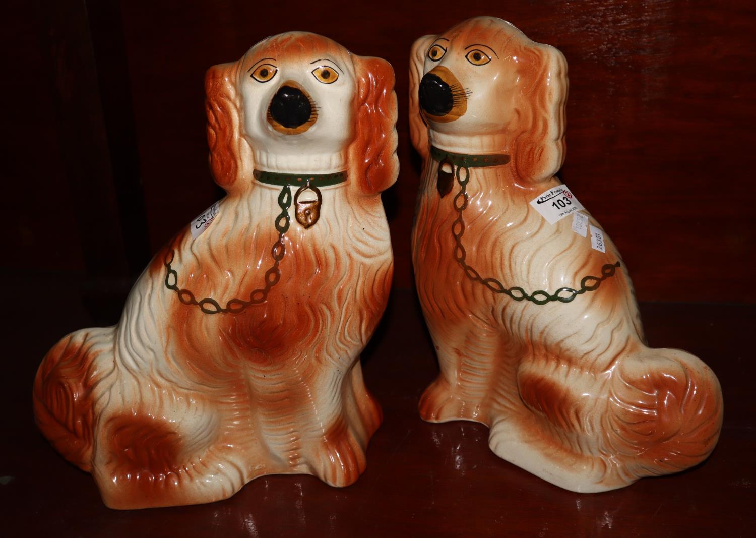 Pair of early 20th Century Staffordshire fireside seated dogs with painted features. (B.P. 21% +