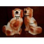 Pair of early 20th Century Staffordshire fireside seated dogs with painted features. (B.P. 21% +