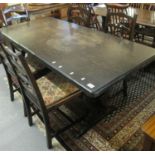 Mid Century stained oak refectory type table, together with a set of five stained ladder back dining