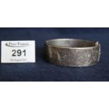 Silver engraved bangle. (B.P. 21% + VAT)