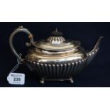 Silver half lobed baluster teapot with scrolled insulated handle and ebony knop. Sheffield