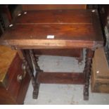 Early 20th Century oak fold over table. 61cm wide approx. (B.P. 21% + VAT) Fair condition only,