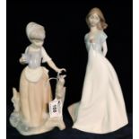 Two Nao Spanish porcelain figurines of young girls, one with butterfly. (2) (B.P. 21% + VAT) No