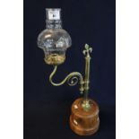 Brass reading candle lamp on turned yew wood base with scrolled sconce arm and clear shade. (B.P.