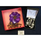 Butler and Wilson purple flower pendant in box. Together with various costume jewellery earrings. (