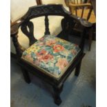 18th Century style heavily carved corner chair having stuff over seat, standing on paw feet. (B.P.