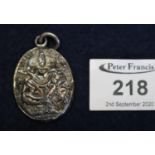 Indian silver repousse memorial locket with glass back and suspension loop. 3.8cm approx. (B.P.