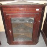 Georgian oak glazed hanging corner cupboard having single door and straight fronted shelves to the