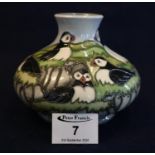 Modern Moorcroft art pottery tube lined Puffin vase, of squat form by Kerri Goodwin. 11cm high