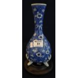 Japanese porcelain bottle vase with overall flower head decoration on cracked ice blue ground,
