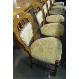 Set of six modern oak spindle dining chairs with upholstered backs and seats on turned supports