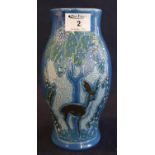 C.H. Brannam pottery Barnstaple Art Deco baluster pottery vase, overall decorated with stylised deer