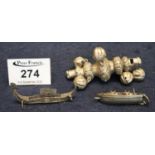 Probably Victorian silver babies rattle, together with two oriental silver miniature boats. 1.5 troy
