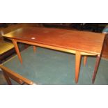 1970's teak coffee table on square tapering legs. (B.P. 21% + VAT)
