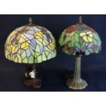 Two similar modern Tiffany style table lamps with mushroom shaped lidded shades, decorated with