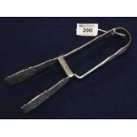 Good quality pair of silver King's pattern asparagus tongs with foliate pierced blades and