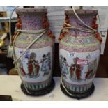Pair of Chinese porcelain baluster vases decorated with reserved panels of figure groups within