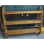 A pine three section open shelving unit with shaped sides. (B.P. 21% + VAT)