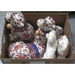 Three Japanese Imari style modern animals, including a pair of dogs, together with a pair of Beswick