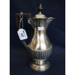 Silver baluster shaped half lobed coffee pot with ebony finial and handle. Sheffield hallmarks, 24cm
