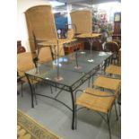 Modern glass top conservatory or garden table with a set of eight wicker armchairs. (9) (B.P.