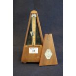 Conically mahogany metronome by Maelzel of Paris. 22cm high aprpox. (B.P. 21% + VAT) Rather dry