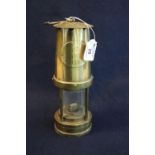 Clark Taylor Group brass miner's safety lamp, appearing unused. 24cm high approx. (B.P. 21% + VAT)