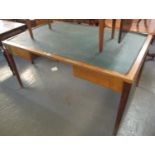 Mid Century oak framed desk with leather top and two pull out drawers standing on chamfered legs. (