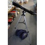 A Celestron power seeker 70AZ telescope on tripod with hood. (B.P. 21% + VAT) appearing good