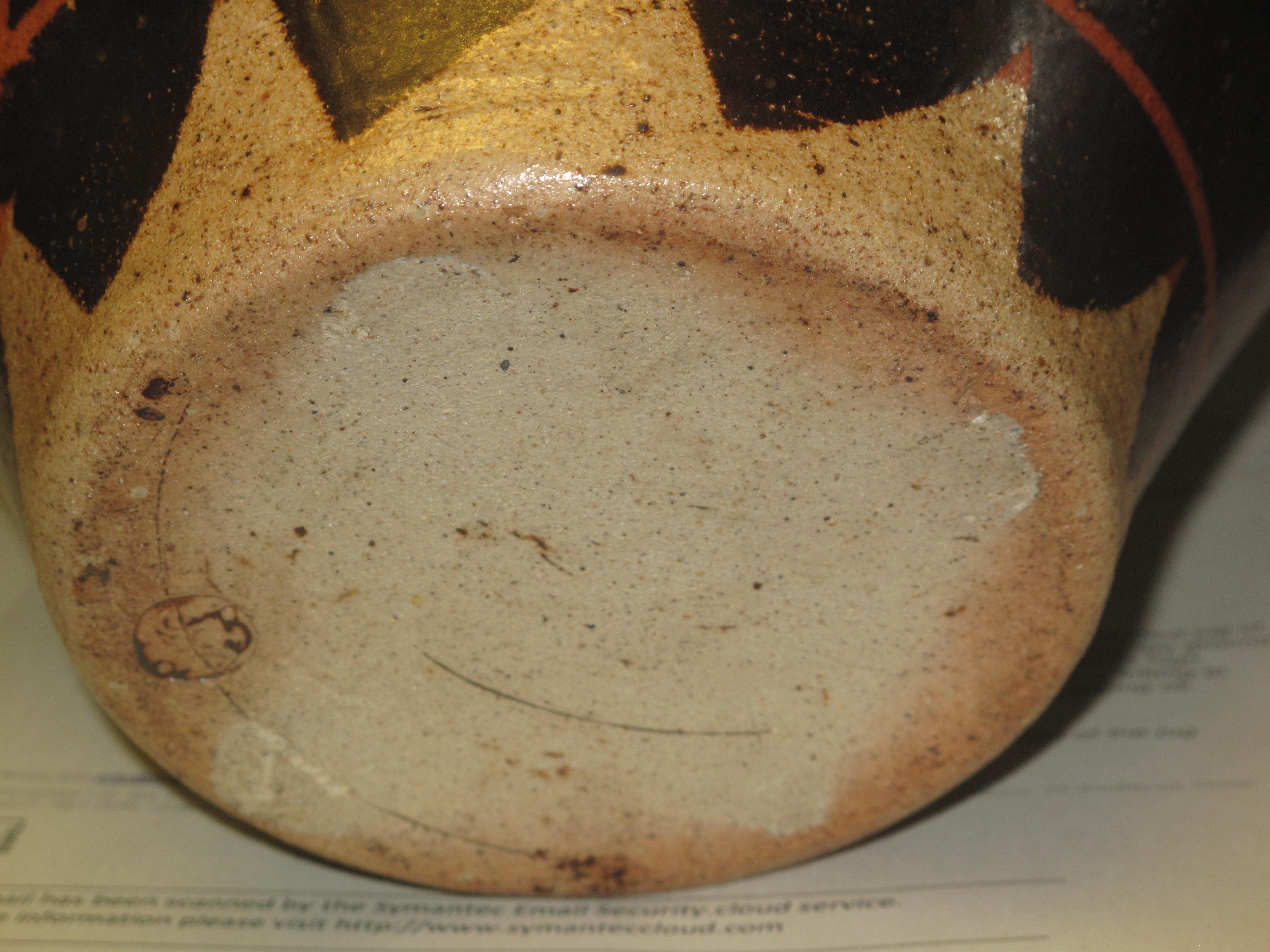 An unusual Art pottery single handled jug of baluster form on a brown and orange ground in the - Image 3 of 4