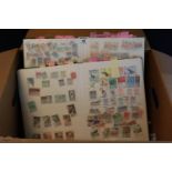All world selection of stamps in a large box including four lighthouse stockbooks of all world and
