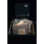 All world selection of stamps in a Clarks shoe box 100's of stamps mint and used on cards and