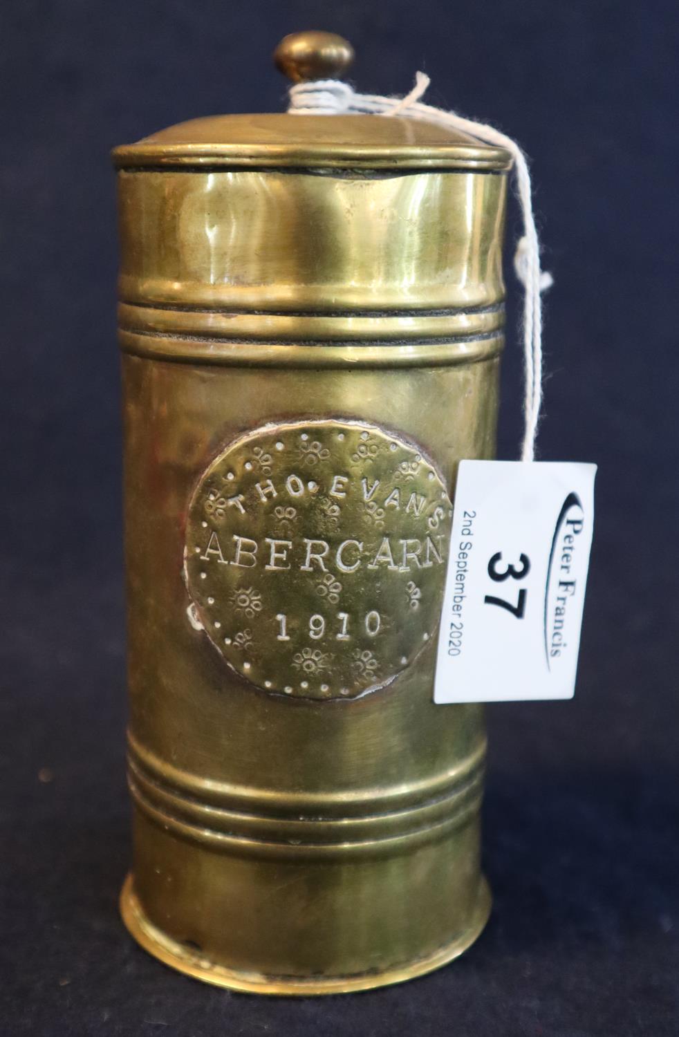 Early 20th Century brass cylindrical miner's tobacco box with cover, applied plate engraved 'T.H.