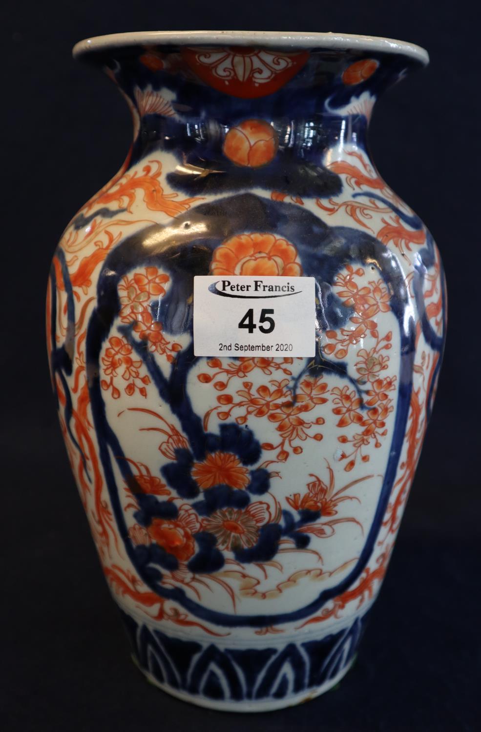 19th/20th Century Japanese Imari baluster shaped vase with flared neck and overall iron red and