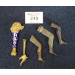 Group of assorted pipe smoking accessories including; yellow metal and enamel tamper, ladies legs