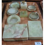 Tray of onyx items to include; cigarette boxes, ashtrays and table lighters. (B.P. 21% + VAT)
