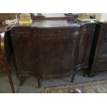 Edwardian mahogany break front blind panelled sideboard, having three doors and standing on tapering
