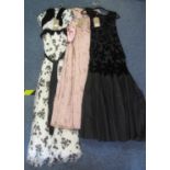 Three vintage (40's-60's) evening dresses to include; a black and white floral tulle and flock