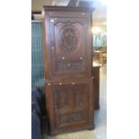 17th Century style oak two stage carved blind panelled corner cabinet. (B.P. 21% + VAT)