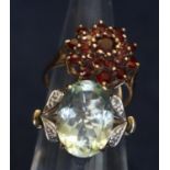 A 9ct gold and garnet cluster ring and a 9ct gold gem set ring. Ring size N and M. Approximate