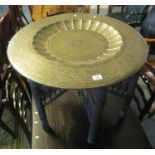 A large brass Middle Eastern design tray top folding table. (B.P. 21% + VAT)