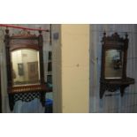 Pair of Edwardian mahogany bevelled mirrors with pierced decoration and under shelves. (2) (B.P. 21%