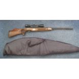Weihraugh West German air rifle with a Bushmaster scope in leather slip. Over 18's only. (B.P. 21% +