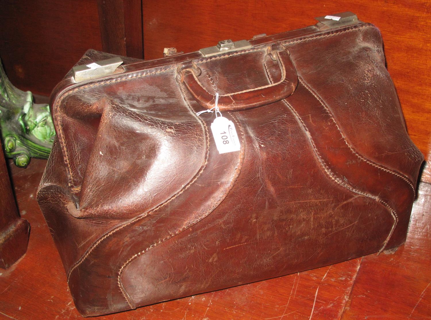 Early 20th century leather gladstone type bag of large proportions. (B.P. 21% + VAT)