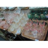 Three trays of assorted glass, mainly drinking glasses, coloured and clear wine glasses, whisky