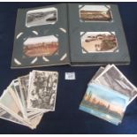 Postcard album with selection of military cards and range of Welsh cards and shoebox of foreign