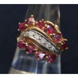 14ct gold ruby and diamond cluster ring. Ring size O. Approximate weight 6.5g (B.P. 21% + VAT)