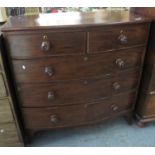 Victorian mahogany bow front chest of two short and three long drawers with turned handles on
